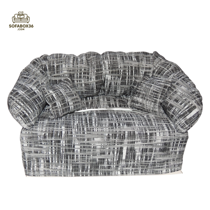 Funda de caja de pañuelos representada como un sofá (blanco y negro).