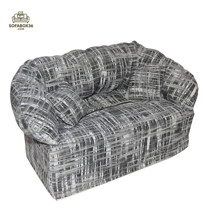 Funda de caja de pañuelos representada como un sofá (blanco y negro).