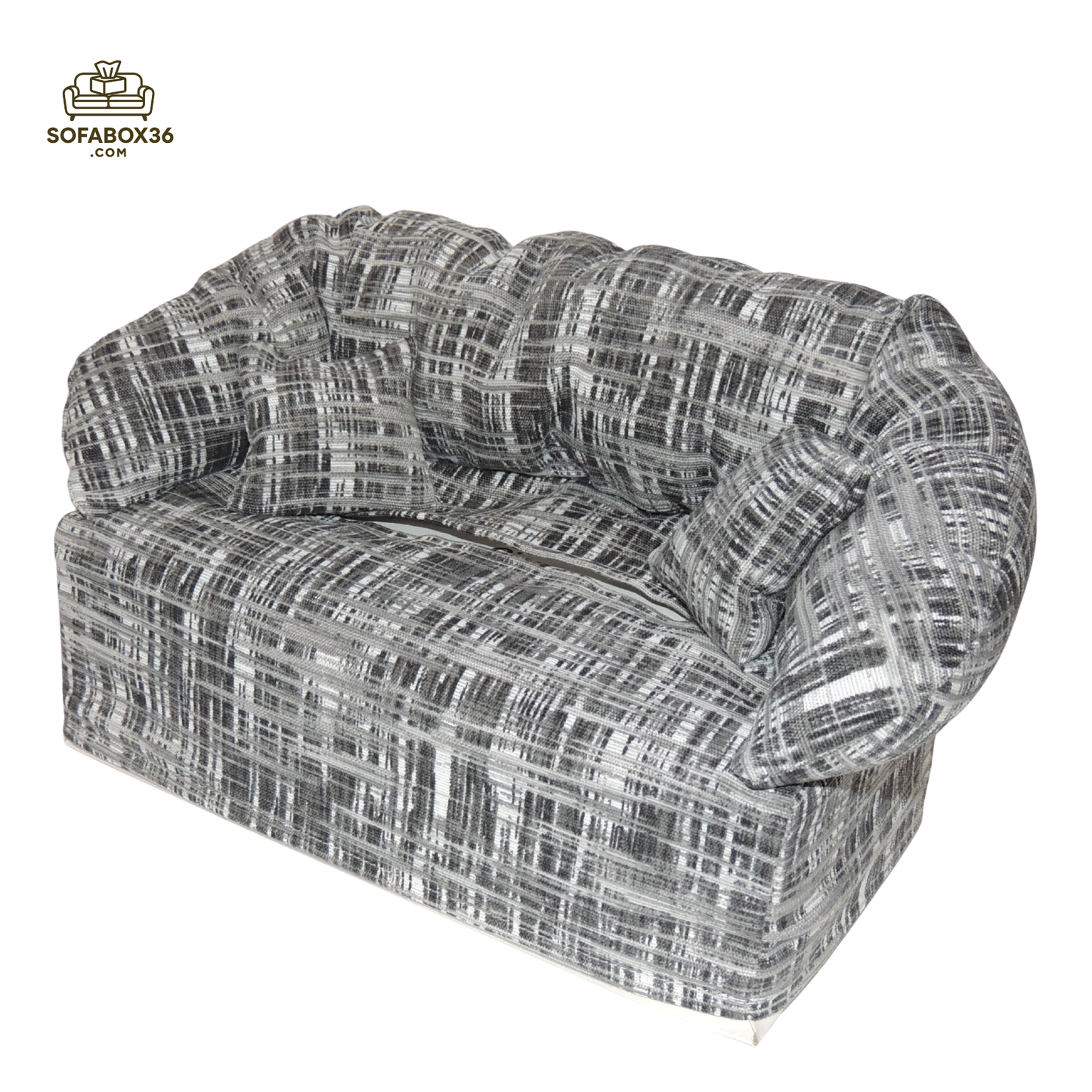 Funda de caja de pañuelos representada como un sofá (blanco y negro).