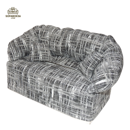 Funda de caja de pañuelos representada como un sofá (blanco y negro).